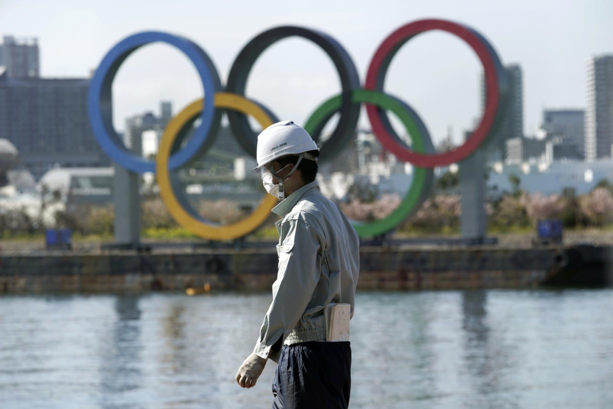 Organizers are moving forward with the Tokyo Olympics as coronavirus fears persist. (AP Photo/Eugene Hoshiko)