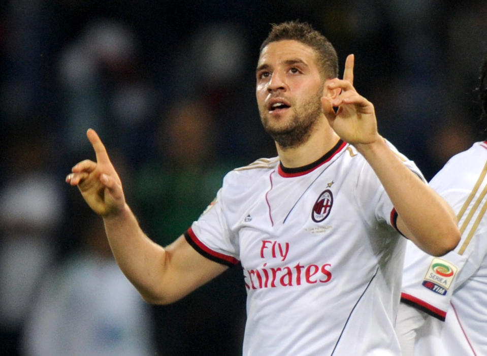 AC Milan forward Adel Taarabt celebrates after scoring during a Serie A soccer match between Genoa and AC Milan, in Genoa's Luigi Ferraris Stadium, Italy, Monday, April 7, 2014. (AP Photo/Tano Pecoraro)