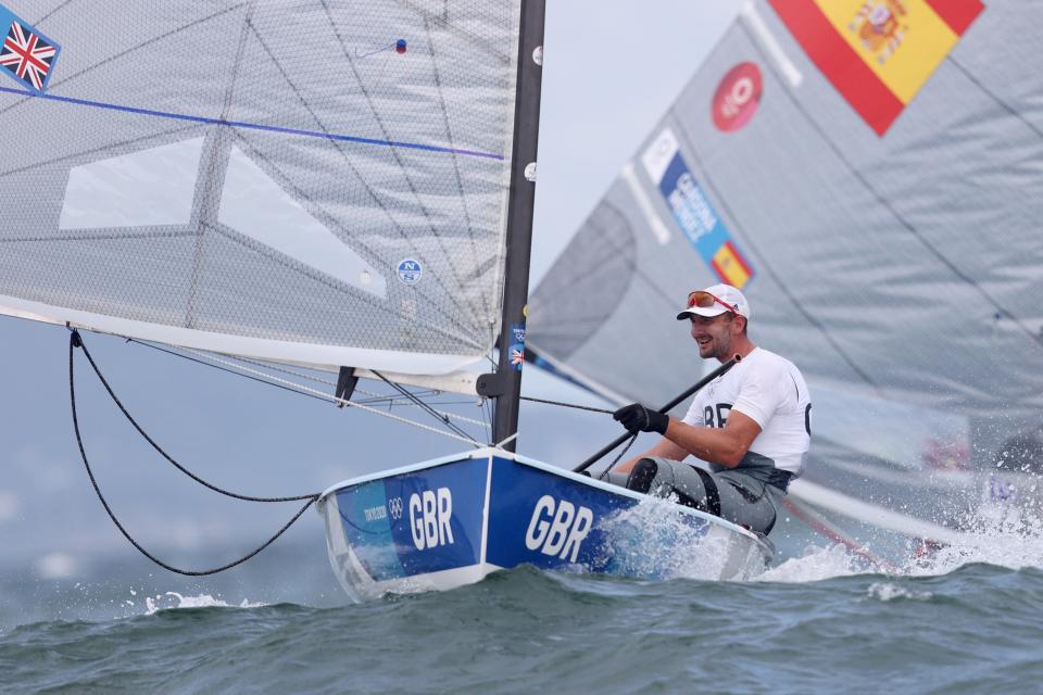 Giles Scott of Team Great Britain competes in the Men's Finn class on day six (Getty)