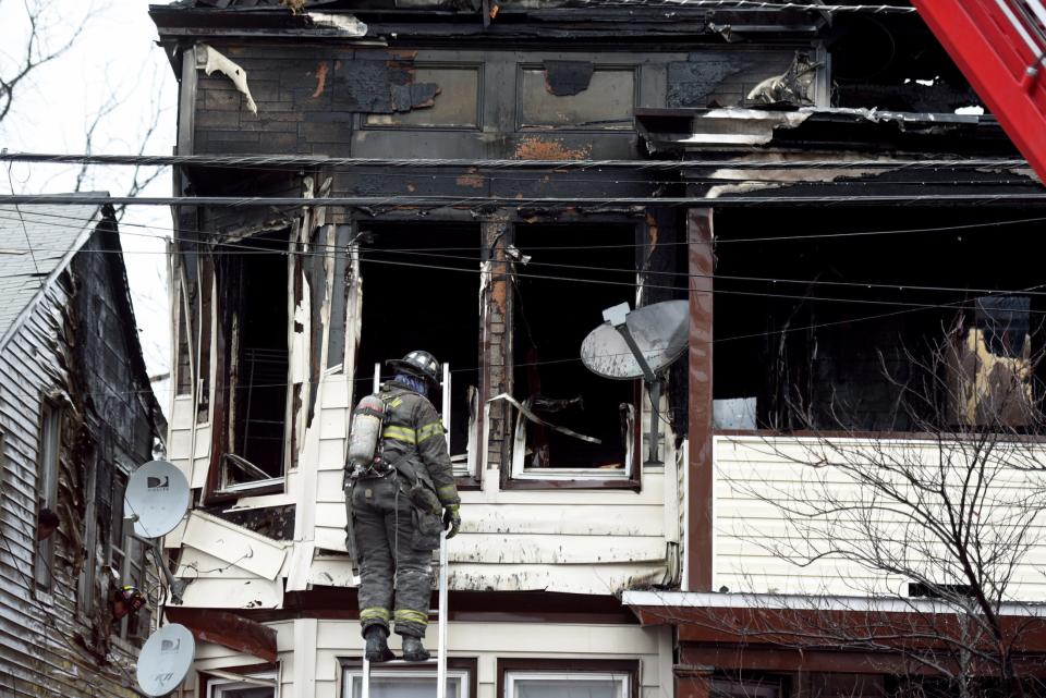 Paterson firefighters respond to a four-alarm blaze at 113 Warren St. in Paterson on January 9, 2022. The fire jumped from 113 Warren St. to multiple dwellings.