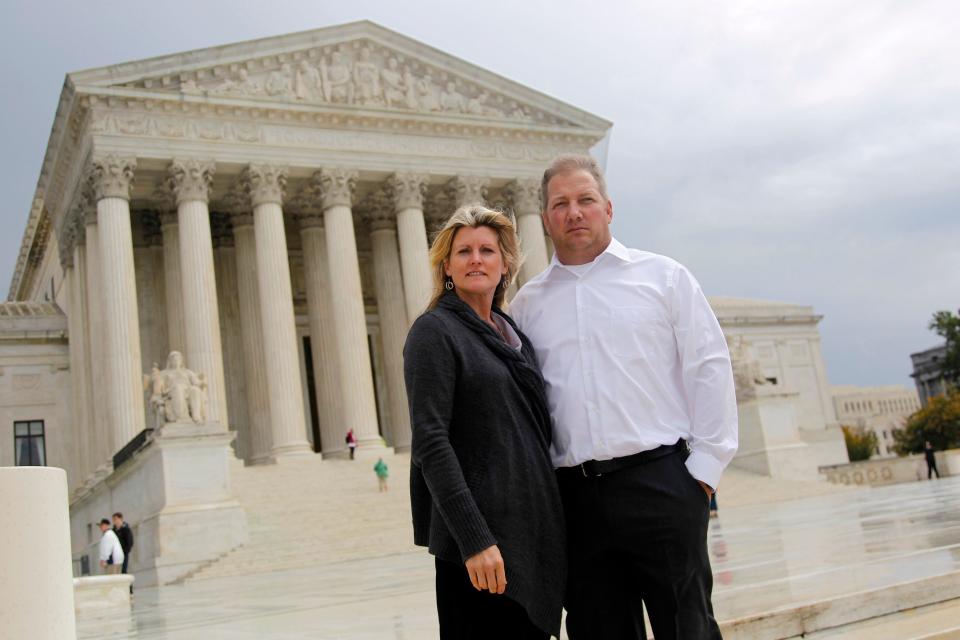 Michael and Chantell Sackett of Priest Lake, Idaho, pose for a photo in front of the Supreme Court in Washington on Oct. 14, 2011.