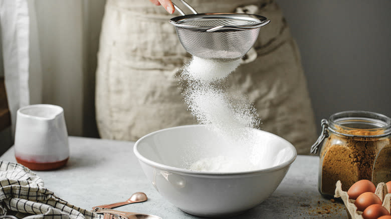 Sifting flour with sieve