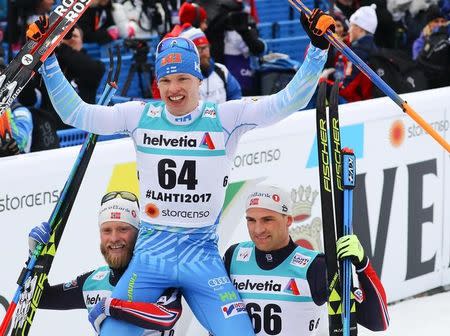 FIS Nordic Ski World Championships - Men's Cross-Country 15 km Classical - Lahti, Finland - 1/3/17 - (L-R) Martin Johnsrud Sundby from Norway, Iivo Niskanen from Finland and Niklas Dyrhaug from Norway pose after the race. REUTERS/Kai Pfaffenbach