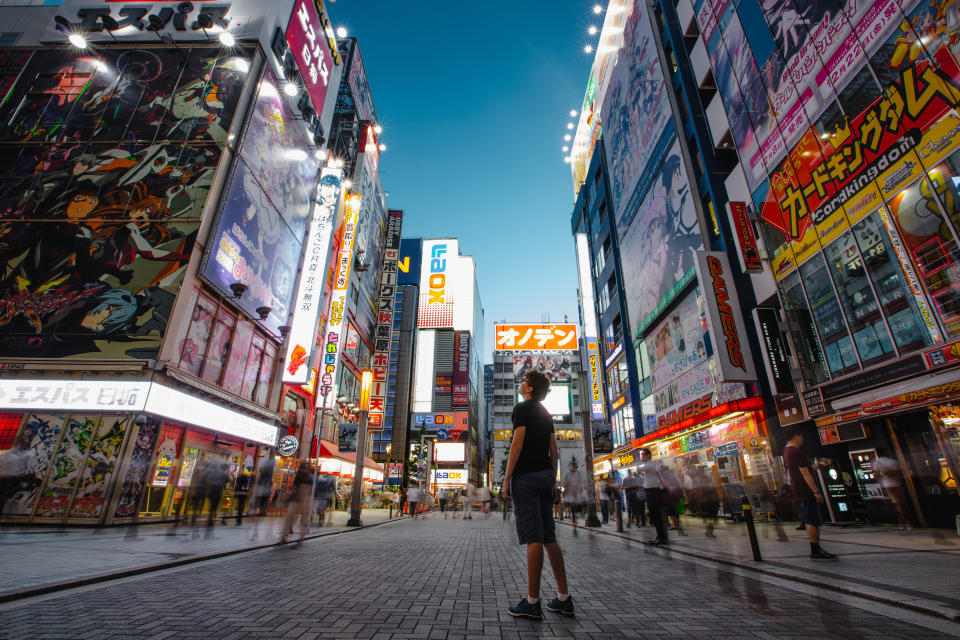 Young man at Akihabara electric town, street view, Tokyo, Japan