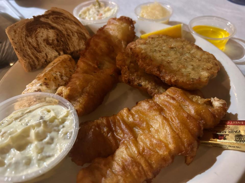 The "Half-and-Half" at Erv's Mug includes two pieces of beer-battered cod and one piece of baked cod, plus soup, Alpha Baking Co. rye bread, tartar sauce, coleslaw and choice of potato.