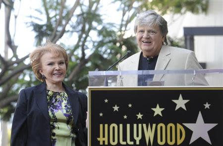 Late musician Buddy Holly's wife Maria Elena Holly (L) looks on as musician Phil Everly speaks during a ceremony posthumously awarding Buddy Holly with a Star on the Hollywood Walk of Fame in Hollywood in this file September 7, 2011 photo. REUTERS/Phil McCarten