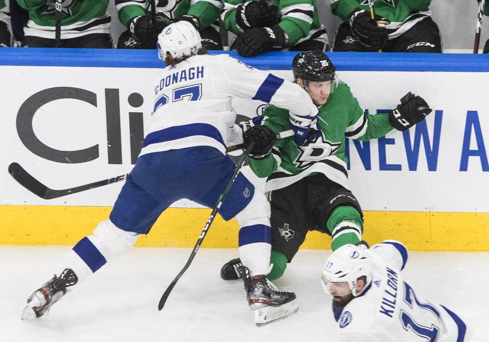 Tampa Bay Lightning's Ryan McDonagh (27) checks Dallas Stars' Joel Kiviranta (25) during second-period NHL Stanley Cup finals hockey game action in Edmonton, Alberta, Monday, Sept. 28, 2020. (Jason Franson/The Canadian Press via AP)