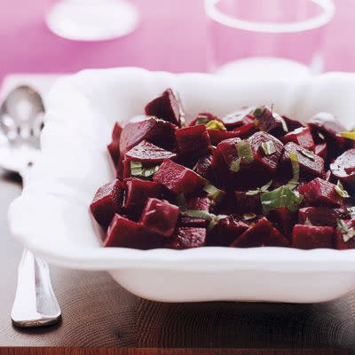 <p>Fresh chopped basil is a cool counterpart to sweet, roasted beets in this easy-to-prepare side dish. Serve with roasted chicken for a delicious dinner.</p><p><strong><a href="https://www.countryliving.com/food-drinks/recipes/a6970/basil-balsamic-beets/" rel="nofollow noopener" target="_blank" data-ylk="slk:Get the recipe;elm:context_link;itc:0;sec:content-canvas" class="link ">Get the recipe</a>.</strong></p><p><strong><a class="link " href="https://www.amazon.com/Chicago-Metallic-Professional-Non-Stick-13-Inch/dp/B003YKGRG4/?tag=syn-yahoo-20&ascsubtag=%5Bartid%7C10050.g.34063059%5Bsrc%7Cyahoo-us" rel="nofollow noopener" target="_blank" data-ylk="slk:SHOP ROASTING PANS;elm:context_link;itc:0;sec:content-canvas">SHOP ROASTING PANS</a><br></strong></p>