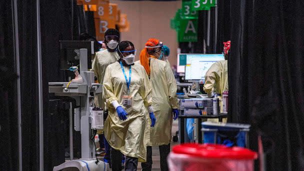 PHOTO: Inside the hot zone medical staff monitor and treat sick patients infected with the COVID-19 virus at the UMASS Memorial DCU Center Field Hospital in Worcester, Mass., January 13, 2021.  (Joseph Prezioso/AFP via Getty Images)