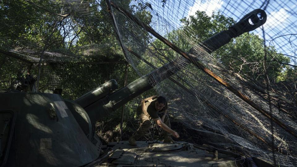 A Ukrainian serviceman of 30th brigade prepares his self propelled artillery to fire towards Russian position in Donetsk region, Ukraine, Tuesday, June 20, 2023. (Evgeniy Maloletka/AP)