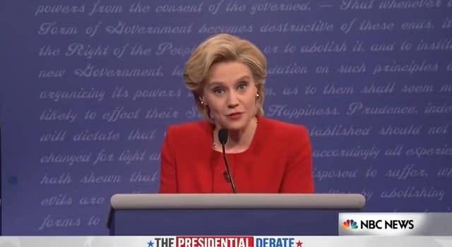 Kate McKinnon as Hillary Clinton behind a podium in "Saturday Night Live"