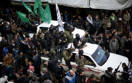 Palestinian Hamas militants attend the funeral of their seven comrades who were killed when a tunnel collapsed close to the Gaza Strip's eastern border with Israel in Gaza City, January 29, 2016. REUTERS/Suhaib Salem