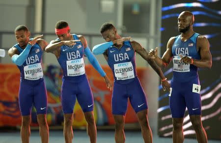 Apr 23, 2017; Nassau, Bahamas; Members of the United States 4 x 400m relay pose as they are introduced during the IAAF World Relays at Thomas A. Robinson Stadium. From left: David Verburg and Tony McQuay and Kyle Clemons and LaShawn Merritt. Mandatory Credit: Kirby Lee-USA TODAY Sports