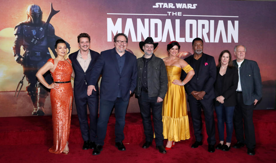 Creator Jon Favreau (3rd L), President of Lucasfilm Kathleen Kennedy (2nd R), executive producer Dave Filoni (C) pose with cast members (L-R) Ming-Na Wen, Pedro Pascal, Gina Carano, Carl Weathers and Werner Herzog at the premiere for the television series "The Mandalorian" in Los Angeles, California, U.S., November 13, 2019. REUTERS/Mario Anzuoni