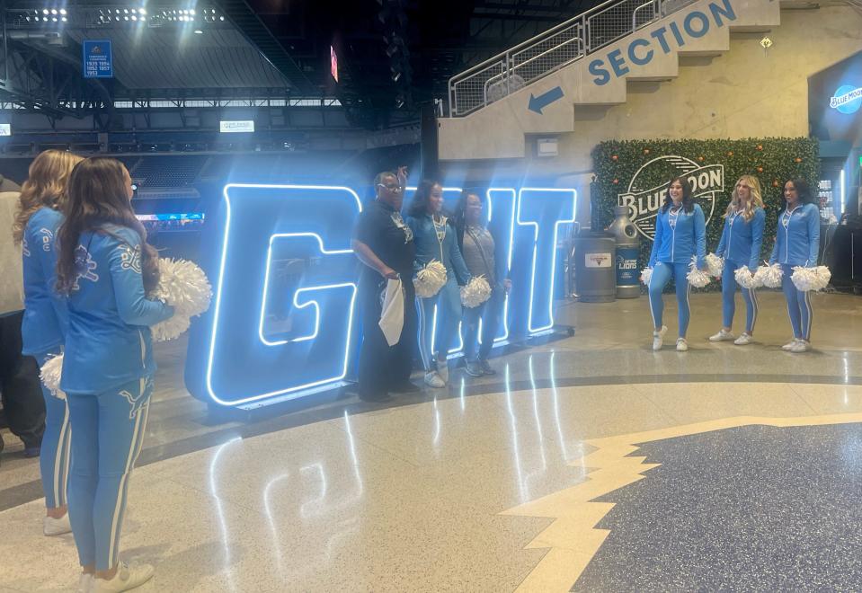 Jackie Smith-Davis, 60, poses with her daughter Le’Elle Davis, a rookie Lions cheerleader who has been dancing since she was 3, at the Lions watch party at Ford Field on Sunday, Jan. 28, 2024.