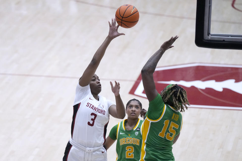 Stanford forward Nunu Agara (3) shoots over Oregon center Phillipina Kyei (15) during the second half of an NCAA college basketball game Friday, Jan. 19, 2024, in Stanford, Calif. (AP Photo/Tony Avelar)