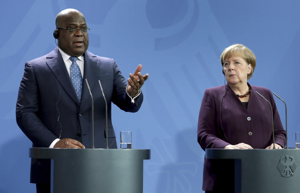 German Chancellor Angela Merkel, right, and Republic of Congo's President Felix Tshisekedi, left, address the media during a joint press conference as part of a meeting at the chancellery in Berlin, Germany, Friday, Nov. 15, 2019. (AP Photo/Michael Sohn)