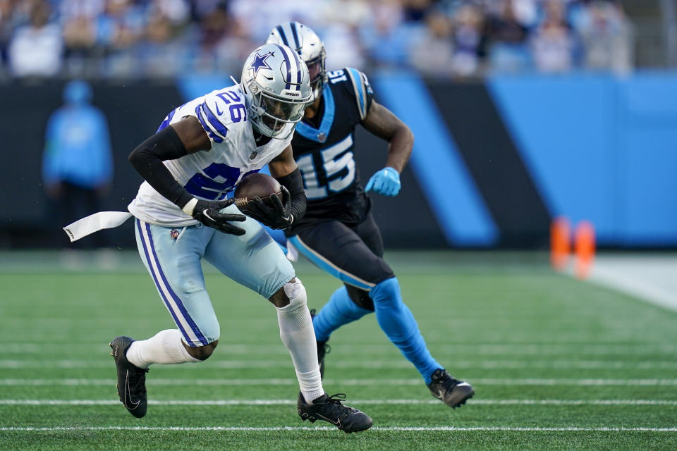 Dallas Cowboys cornerback DaRon Bland intercepts a pass intended for Carolina Panthers wide receiver Jonathan Mingo during the second half of an NFL football game Sunday, Nov. 19, 2023, in Charlotte, N.C. Bland scored n the play. (AP Photo/Erik Verduzco)