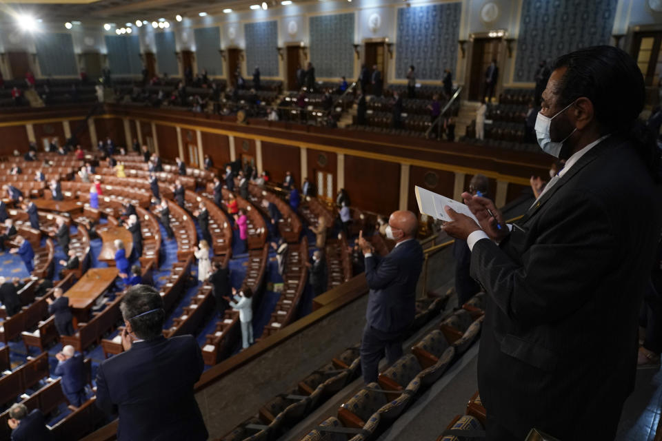 Member of Congress applaud as President Joe Biden speaks to a joint session of Congress Wednesday, April 28, 2021, in the House Chamber at the U.S. Capitol in Washington. (AP Photo/Andrew Harnik, Pool)