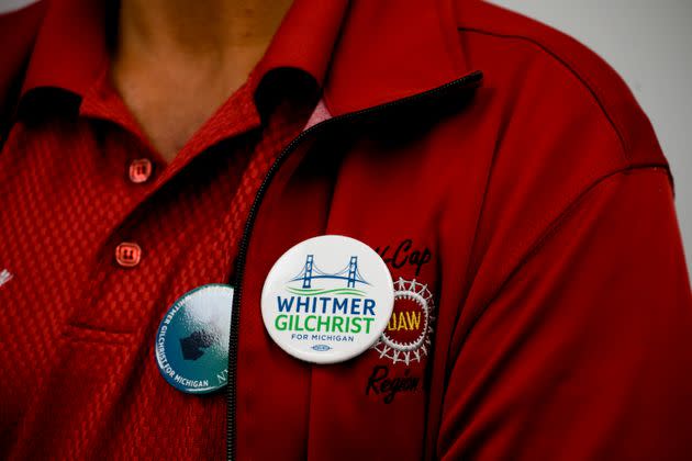 A UAW worker wears a pin in support of Whitmer during a campaign event at the UAW Local 3000 offices on Oct. 26. (Photo: Brittany Greeson for HuffPost)