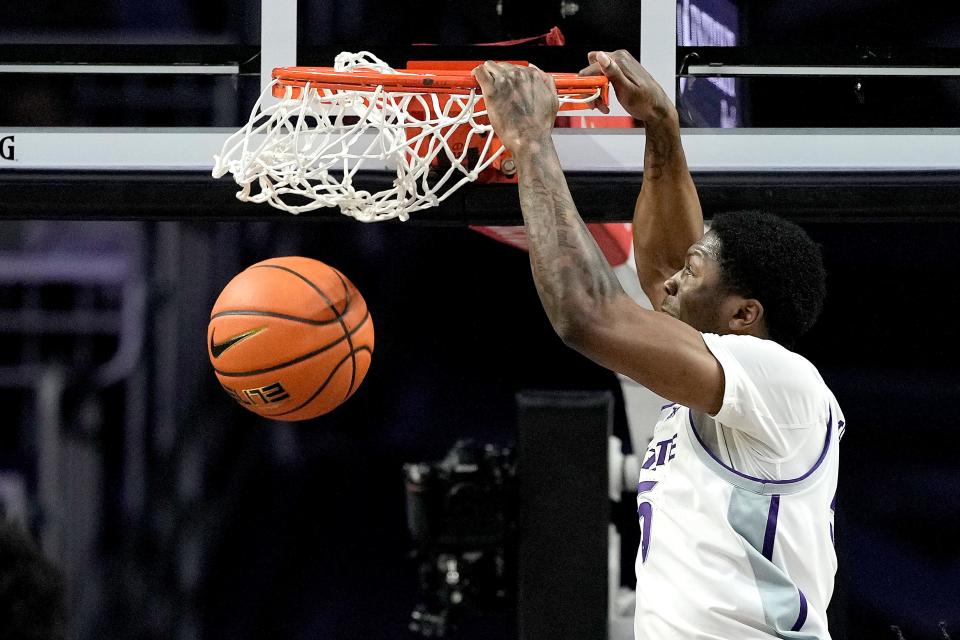 Kansas State guard Cam Carter dunks the ball during the first half of an NCAA college basketball game against Iowa State Saturday, March 9, 2024, in Manhattan, Kan. (AP Photo/Charlie Riedel)