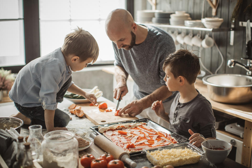 A family making pizza at home