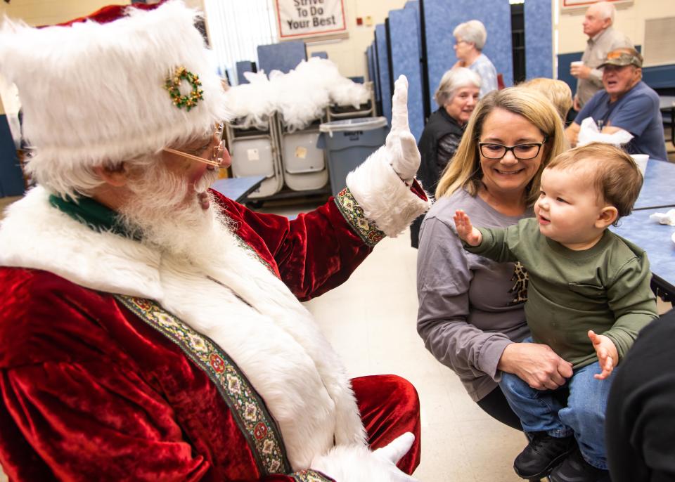 This photo from December 2023 shows Santa with a child and their grandmother on Pancake Day in Ocala, Fla. Young Harris Church of Athens will host a Breakfast With Santa event on Saturday, Dec. 16.