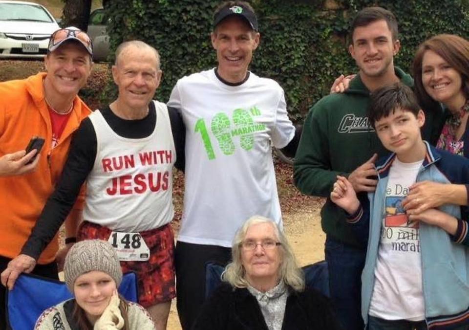 Bill Johncock, center, and Logan Johncock, in the blue shirt at right, photographed with family after he completed his 100th lifetime marathon: the Peak to Creek Marathon near Morganton, N.C., in 2015.