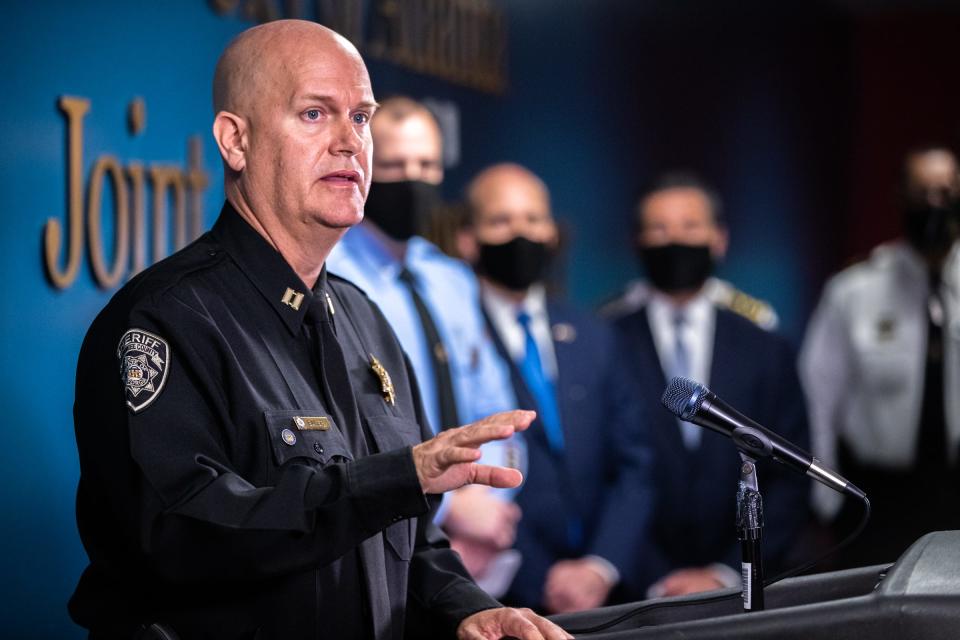 Captain Jay Baker, of the Cherokee County Sheriff’s Office, addresses media during a press conference at the Atlanta Public Safety Headquarters,  March 17, 2021, following a series of shootings Tuesday night at three different massage parlors killing eight people, six of whom were Asian.
