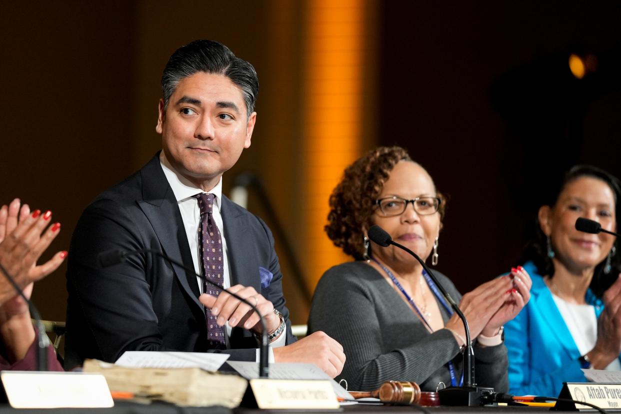 Cincinnati Mayor Aftab Pureval, left, kicks off the inaugural session of the city council on Tuesday, Jan. 2, 2024, at Music Hall Ballroom in Over-the-Rhine.