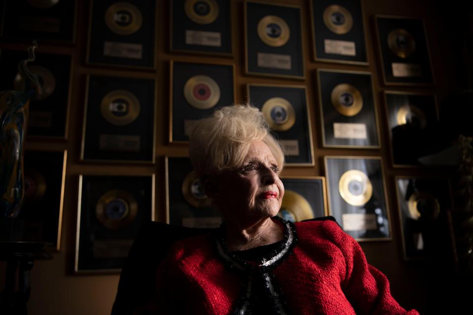 Brenda Lee sits in front of a wall covered in her gold records at her home in Nashville , Tenn., Tuesday, Nov. 7, 2023.