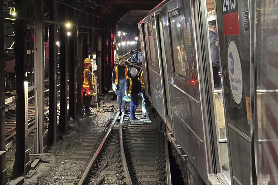 This photo provided by NYC Emergency Management shows the derailment of a New York City subway car, Thursday, Jan. 4, 2024. A New York City subway train derailed Thursday after colliding with another train, leaving more than 20 people with minor injuries including some who were brought to hospitals, the New York City Police Department said. (NYC Emergency Management via AP)