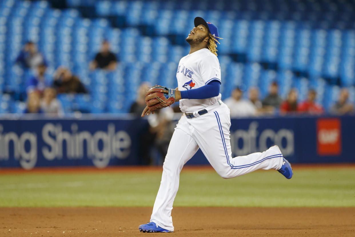 TORONTO, ON - SEPTEMBER 11: Vladimir Guerrero Jr. #27 of the Toronto Blue Jays runs to catch a pop fly during eighth inning of their MLB game against the Boston Red Sox at Rogers Centre on September 11, 2019 in Toronto, Canada. (Photo by Cole Burston/Getty Images)