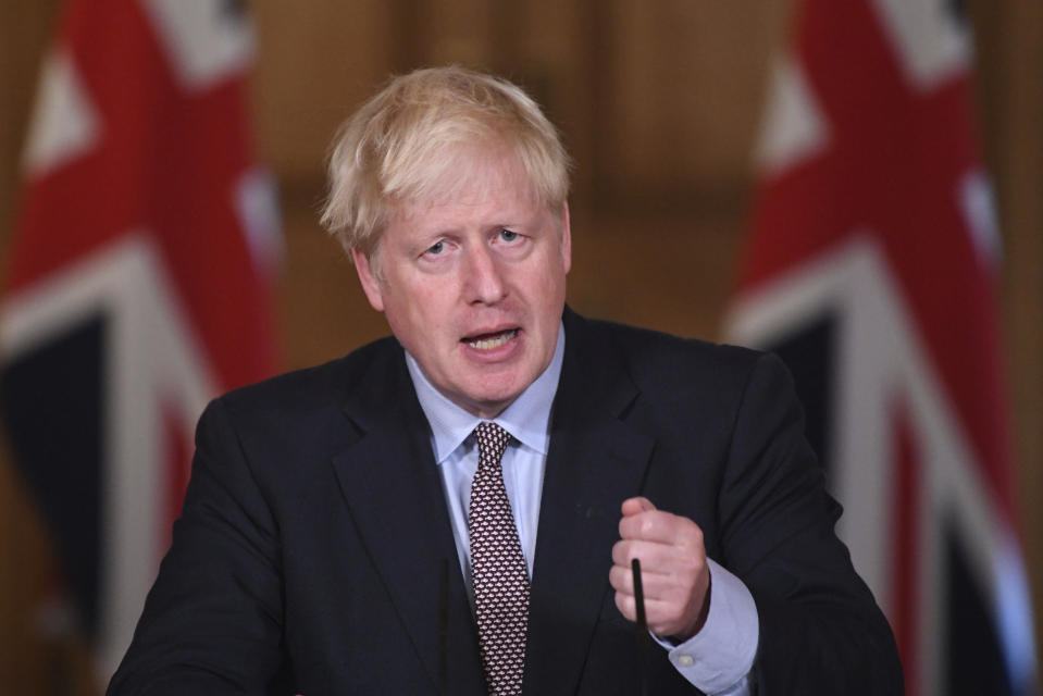 Britain's Prime Minister Boris Johnson speaks during a virtual press conference at Downing Street, London, Wednesday Sept. 9, 2020, following the announcement that the legal limit on social gatherings is set to be reduced from 30 people to six. The change in England will come into force on Monday as the Government seeks to curb the rise in coronavirus cases. (Stefan Rousseau/Pool via AP)