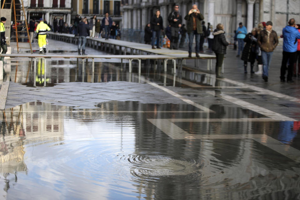 Water starts rising again in Venice, Italy, Saturday, Nov. 16, 2019. High tidal waters returned to Venice on Saturday, four days after the city experienced its worst flooding in 50 years. (AP Photo/Luca Bruno)