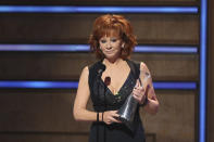 Reba McEntire accepts the Artist of a Lifetime award at 2019 CMT Artists of the Year at Schermerhorn Symphony Center on Wednesday, Oct. 16, 2019, in Nashville, Tenn. (Photo by Al Wagner/Invision/AP)