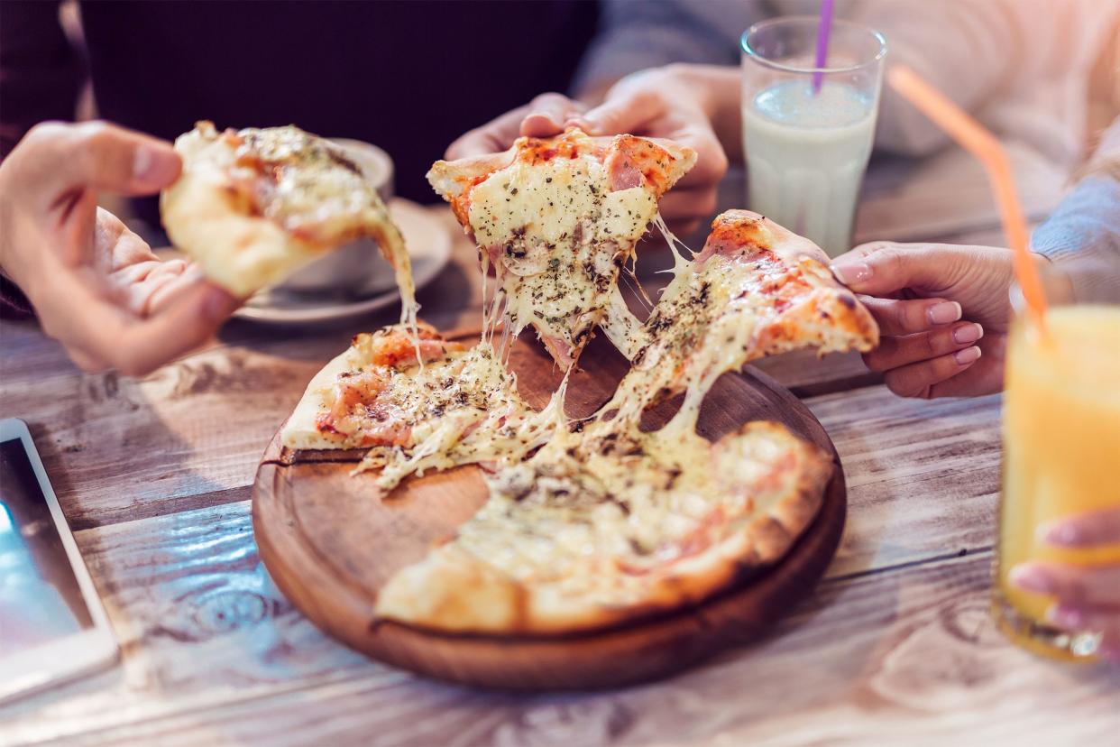 Friends sharing pizza