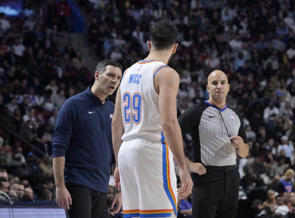 Oct 12, 2023; Montreal, Quebec, CAN; Oklahoma City Thunder head coach Mark Daigneault talks to guard Vasilije Micic (29) during the fourth quarter against the Detroit Pistons at the Bell Centre. Mandatory Credit: Eric Bolte-USA TODAY Sports