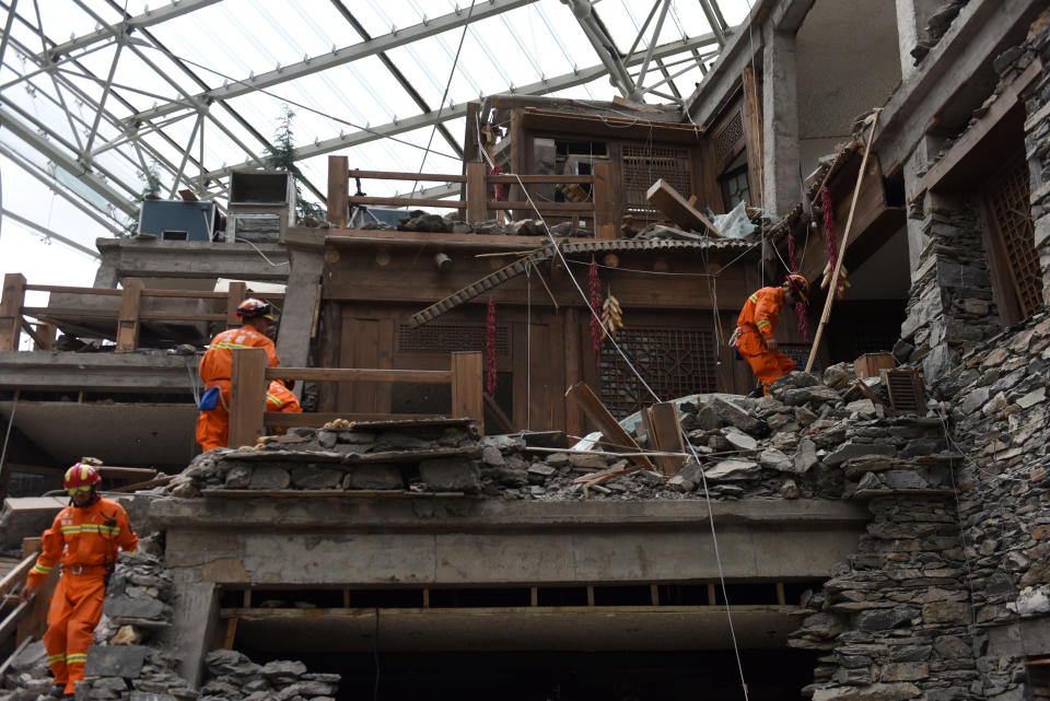 <p>Rescue workers search for survivors at a damaged hotel after an earthquake in Jiuzhaigou county, Ngawa prefecture, Sichuan province, China, Aug. 9, 2017. (Photo: Stringer/Reuters) </p>