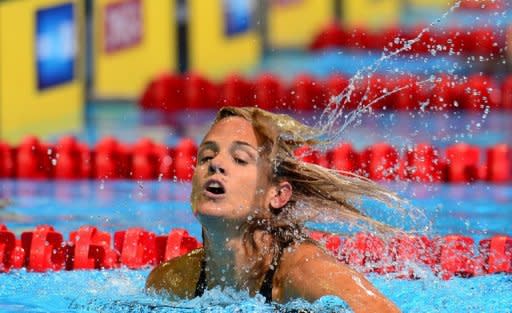 Dara Torres, 45, celebrates her second place finish following the women's 50m Freestyle semifinal on day seven of the 2012 US Olympic Team Trials on July 1, 2012 in Omaha, Nebraska, which was won by Jessica Hardy