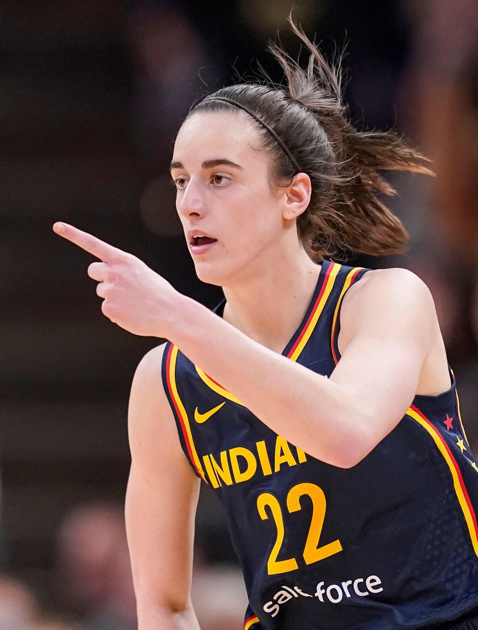 Indiana Fever guard Caitlin Clark (22) reacts to scoring three points Thursday, May 9, 2024, during the preseason game against the Atlanta Dream at Gainbridge Fieldhouse in Indianapolis. The Indiana Fever defeated the Atlanta Dream, 83-80.