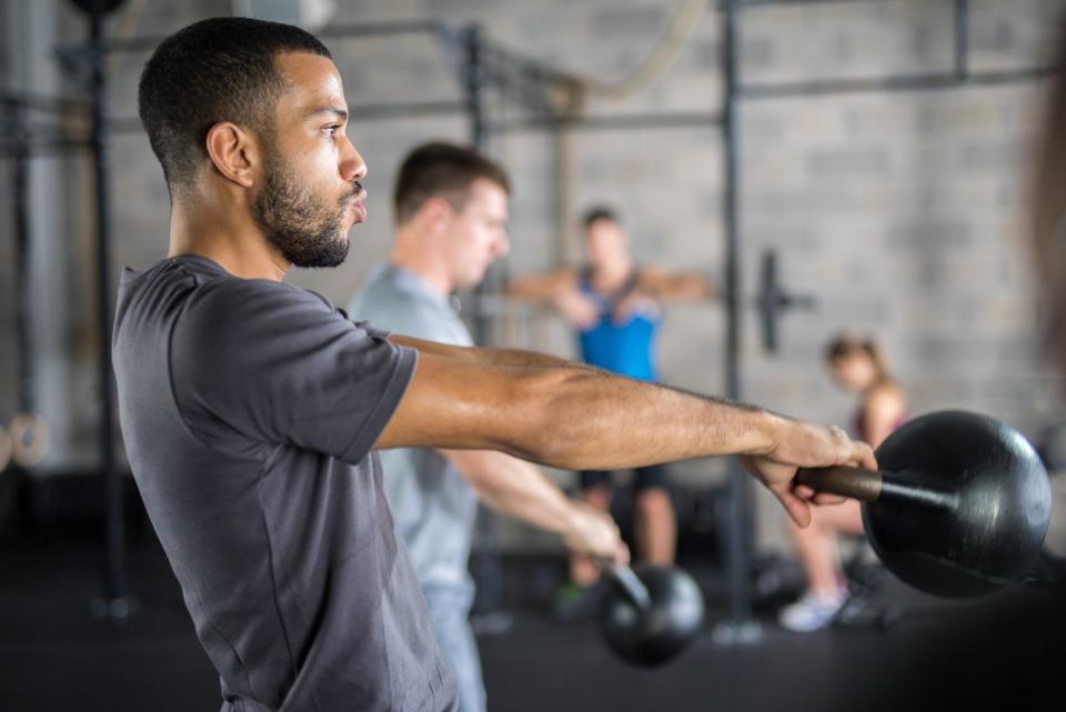 young man exercising in gym