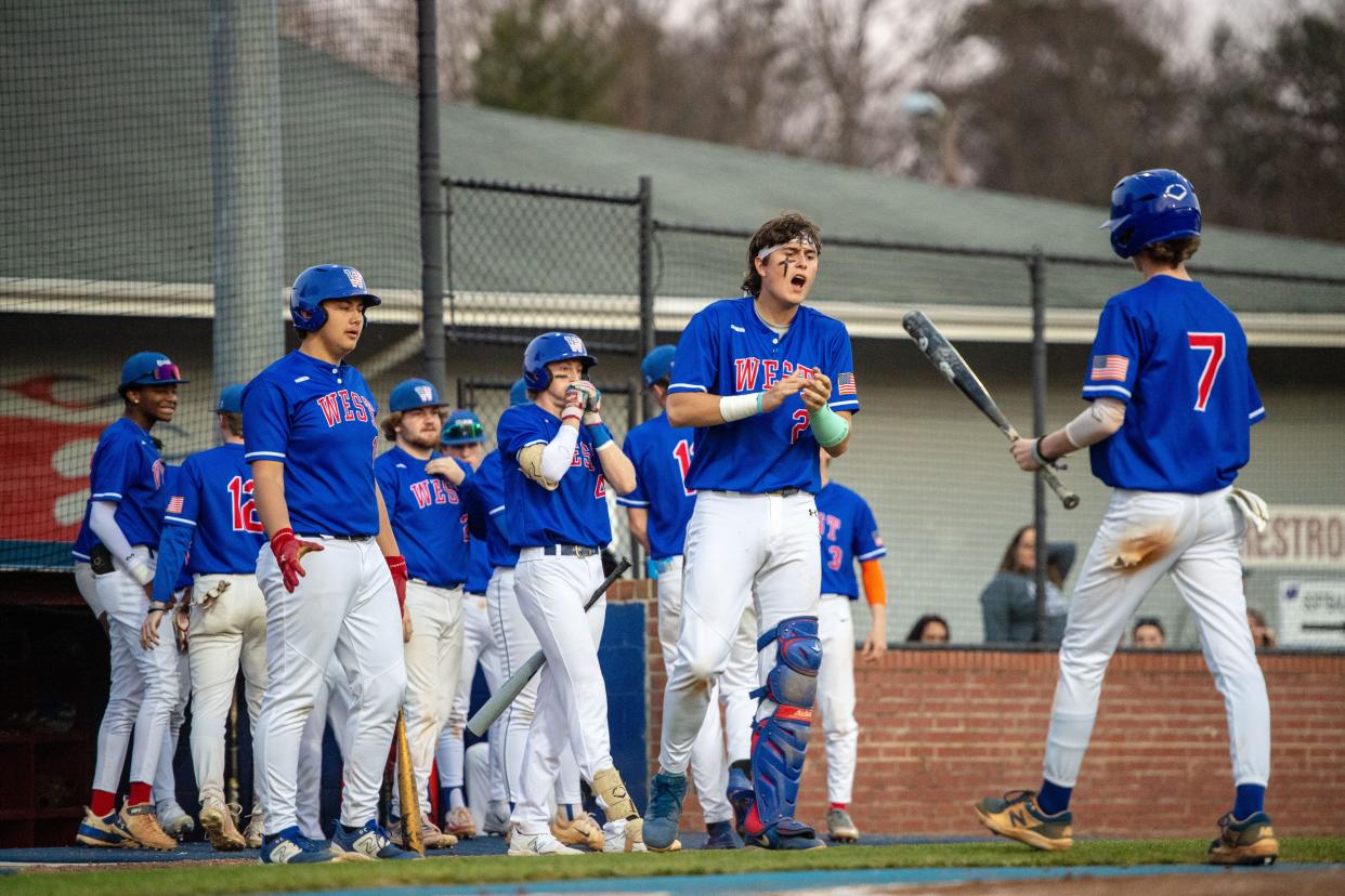 West Henderson celebrates during its game against Roberson on March 13, 2024, in Hendersonville.