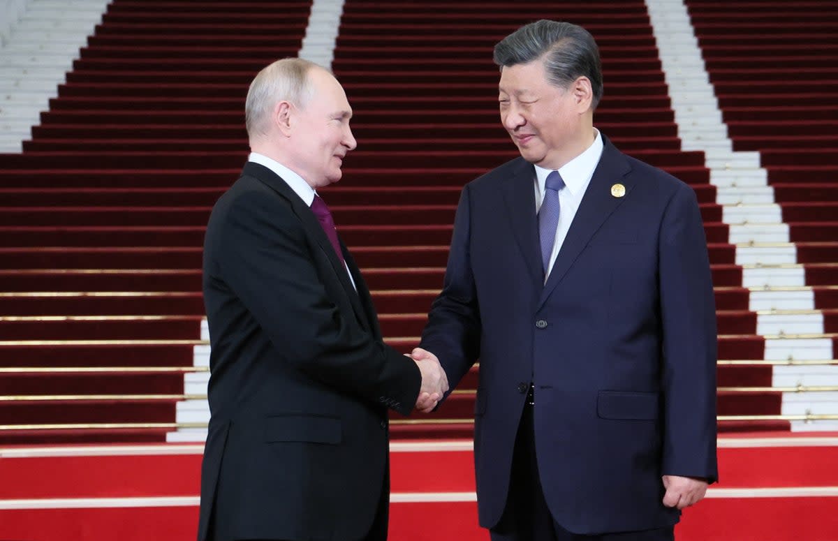 Russia's President Vladimir Putin and Chinese President Xi Jinping shaking hands during a welcoming ceremony at the Third Belt and Road Forum in Beijing (POOL/AFP via Getty Images)