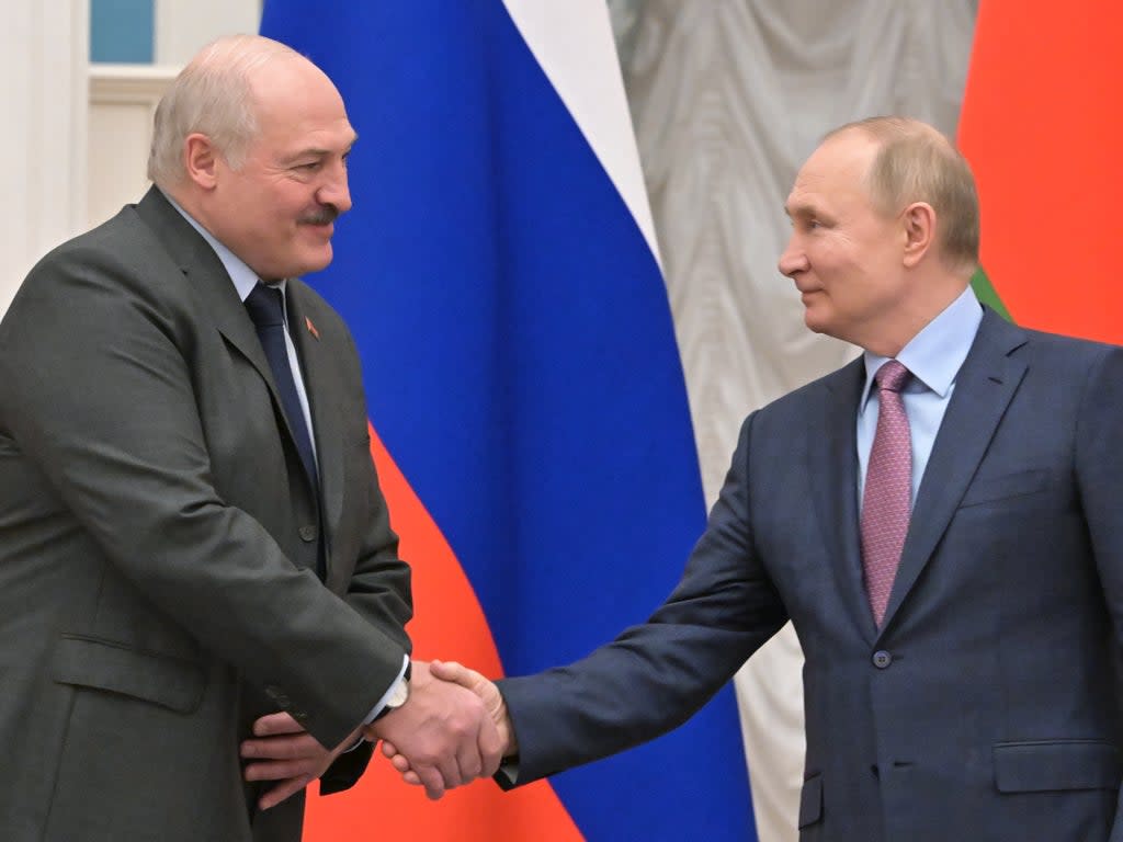 File photo: Alexander Lukashenko and Vladimir Putin shake hands during a joint press conference at the Kremlin in Moscow, Russia, 18 February 2022 (EPA-EFE)