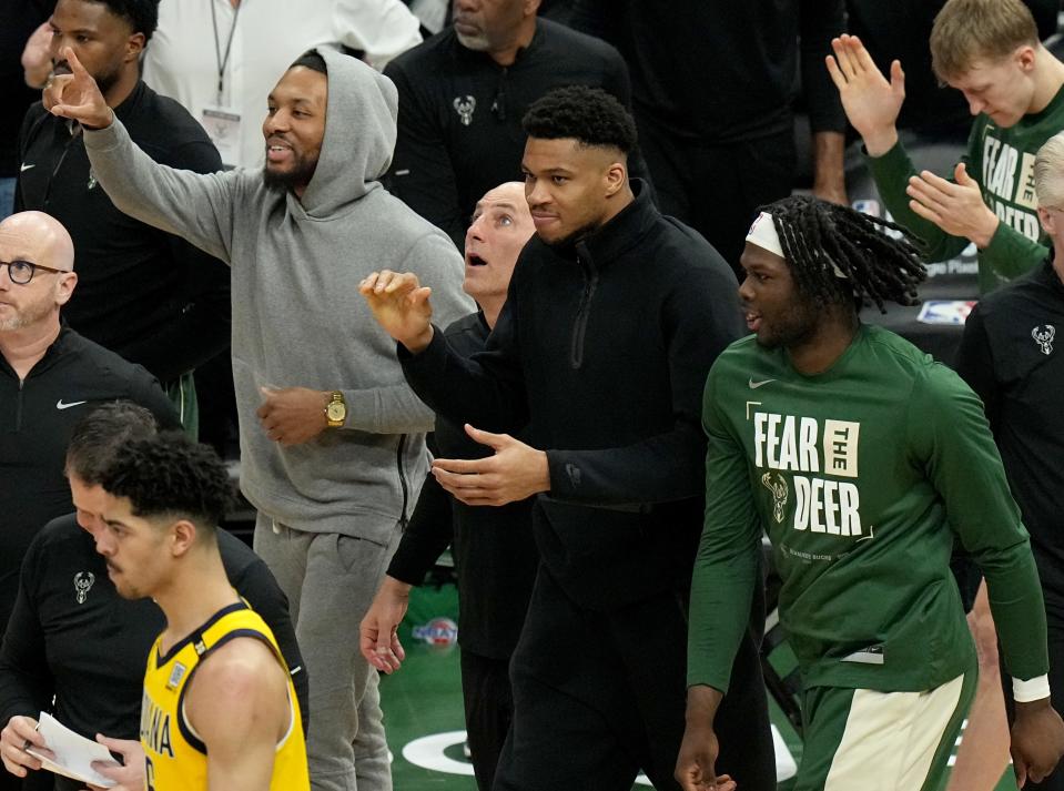 Injured guard Damian Lillard (0) and forward Giannis Antetokounmpo are shown during the second half of their playoff game Tuesday, April 30, at Fiserv Forum. The Milwaukee Bucks beat the Indiana Pacers 115-92, in Game 5 but lost the next game and the series, 4-2.