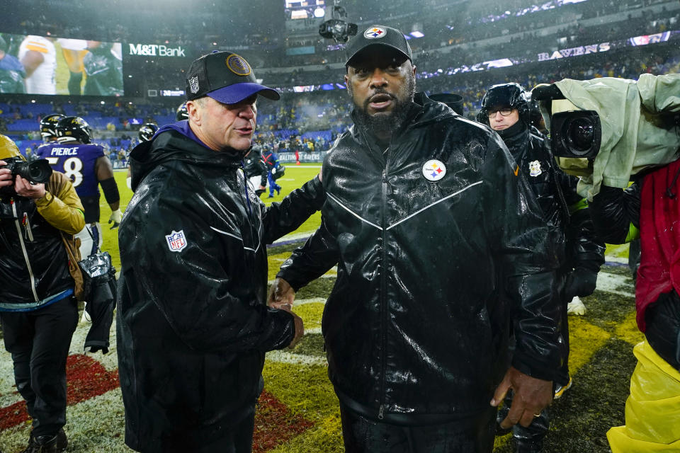 Baltimore Ravens head coach John Harbaugh, left, talks with Pittsburgh Steelers head coach Mike Tomlin following an NFL football game, Saturday, Jan. 6, 2024 in Baltimore. The Steelers won 17-10. (AP Photo/Matt Rourke)