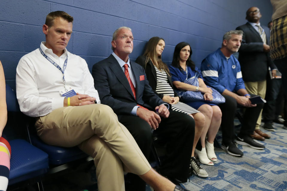 Indianapolis Colts general manager Chris Ballard, left, and owner Jim Irsay, second from left, listen as Colts quarterback Andrew Luck speaks during a news conference following the team's NFL preseason football game against the Chicago Bears, Saturday, Aug. 24, 2019, in Indianapolis. The oft-injured star is retiring at age 29. (AP Photo/AJ Mast)