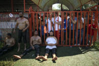 Fans watch as restlers rest after they competed on the second day of the 660th instalment of the annual Historic Kirkpinar Oil Wrestling championship, in Edirne, northwestern Turkey, Saturday, July 10, 2021.Thousands of Turkish wrestling fans flocked to the country's Greek border province to watch the championship of the sport that dates to the 14th century, after last year's contest was cancelled due to the coronavirus pandemic. The festival, one of the world's oldest wrestling events, was listed as an intangible cultural heritage event by UNESCO in 2010. (AP Photo/Emrah Gurel)