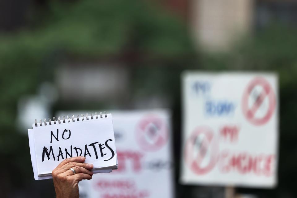 People protest vaccine mandates Aug. 9 in New York City.